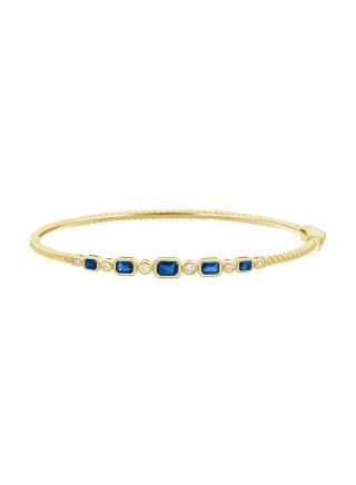0.84CT SAPPHIRE AND ROUND DIAMOND BEZEL SET BANGLE
